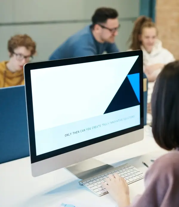 A person behind a computer in a recruitment agency